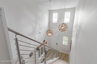 Welcome to 118 Pitching Wedge Drive, a stunning 2023-built home on LPGA International Golf Course in Florida - for sale on GolfHomes.com, golf home, golf lot