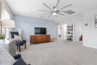 Welcome to 118 Pitching Wedge Drive, a stunning 2023-built home on LPGA International Golf Course in Florida - for sale on GolfHomes.com, golf home, golf lot