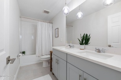 Welcome to 118 Pitching Wedge Drive, a stunning 2023-built home on LPGA International Golf Course in Florida - for sale on GolfHomes.com, golf home, golf lot