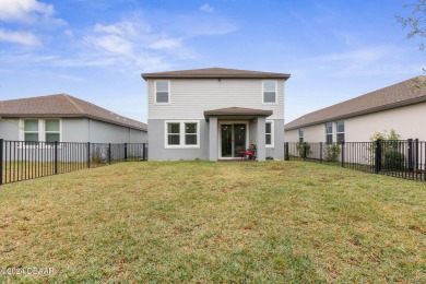 Welcome to 118 Pitching Wedge Drive, a stunning 2023-built home on LPGA International Golf Course in Florida - for sale on GolfHomes.com, golf home, golf lot