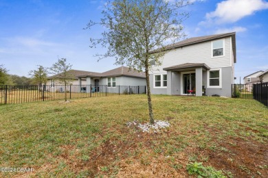 Welcome to 118 Pitching Wedge Drive, a stunning 2023-built home on LPGA International Golf Course in Florida - for sale on GolfHomes.com, golf home, golf lot