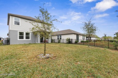 Welcome to 118 Pitching Wedge Drive, a stunning 2023-built home on LPGA International Golf Course in Florida - for sale on GolfHomes.com, golf home, golf lot