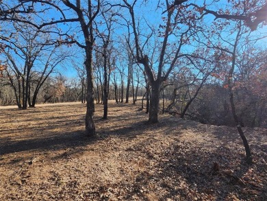 Beautiful corner lot build site with lake views and mature oak on Nocona Hills Golf Course in Texas - for sale on GolfHomes.com, golf home, golf lot