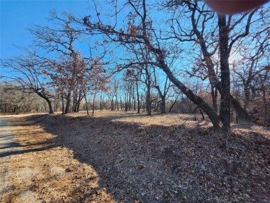 Beautiful corner lot build site with lake views and mature oak on Nocona Hills Golf Course in Texas - for sale on GolfHomes.com, golf home, golf lot