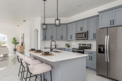 Welcome to this beautifully updated four-bedroom on Lexington Oaks Golf Club in Florida - for sale on GolfHomes.com, golf home, golf lot