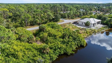 Discover the perfect canvas for your Florida waterfront dream at on Sabal Trace Golf and Country Club in Florida - for sale on GolfHomes.com, golf home, golf lot