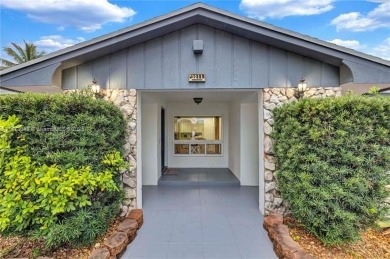 Nestled on a spectacular, tree-lined site in a quiet, low on Orangebrook Golf and Country Club in Florida - for sale on GolfHomes.com, golf home, golf lot