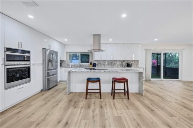 Nestled on a spectacular, tree-lined site in a quiet, low on Orangebrook Golf and Country Club in Florida - for sale on GolfHomes.com, golf home, golf lot