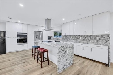 Nestled on a spectacular, tree-lined site in a quiet, low on Orangebrook Golf and Country Club in Florida - for sale on GolfHomes.com, golf home, golf lot