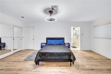 Nestled on a spectacular, tree-lined site in a quiet, low on Orangebrook Golf and Country Club in Florida - for sale on GolfHomes.com, golf home, golf lot