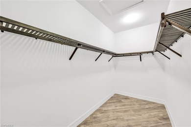 Welcome to elegant coastal living in sought after Fiddler's on The Golf Club At Fiddlers Creek in Florida - for sale on GolfHomes.com, golf home, golf lot