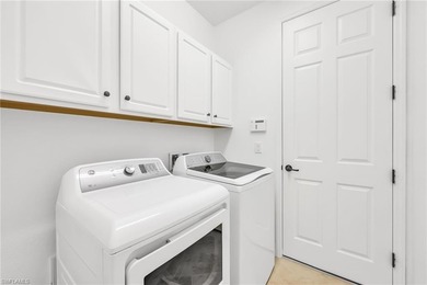 Welcome to elegant coastal living in sought after Fiddler's on The Golf Club At Fiddlers Creek in Florida - for sale on GolfHomes.com, golf home, golf lot