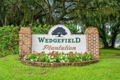 Nestled within a prestigious golf community, this immaculate on Wedgefield Plantation Golf Club in South Carolina - for sale on GolfHomes.com, golf home, golf lot