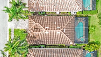 Welcome to elegant coastal living in sought after Fiddler's on The Golf Club At Fiddlers Creek in Florida - for sale on GolfHomes.com, golf home, golf lot