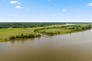 Nestled within a prestigious golf community, this immaculate on Wedgefield Plantation Golf Club in South Carolina - for sale on GolfHomes.com, golf home, golf lot