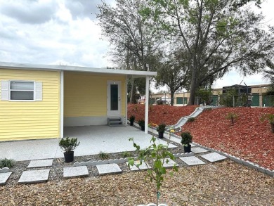 STEP INTO THIS BEAUTIFULLY UPDATED 2-BEDROOM 2-BATHROOM HOME! on Anglers Green Golf Course in Florida - for sale on GolfHomes.com, golf home, golf lot