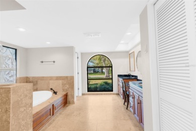 Discover elegance and comfort in this stunning 4-bedroom on Tampa Palms Golf and Country Club in Florida - for sale on GolfHomes.com, golf home, golf lot
