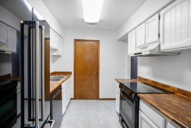 This stylish penthouse townhouse features 2 bedrooms and 1.5 on Arroyo Del Oso Golf Course in New Mexico - for sale on GolfHomes.com, golf home, golf lot