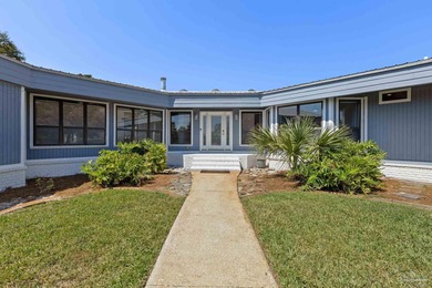 Discover effortless Florida living in this beautifully updated on Tiger Point Golf and Country Club in Florida - for sale on GolfHomes.com, golf home, golf lot