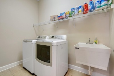 This meticulously maintained Southwood home overlooks the golf on Southwood Golf Club in Florida - for sale on GolfHomes.com, golf home, golf lot