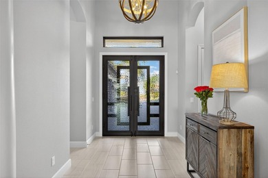 Discover unparalleled luxury in this exquisite Lakewood Ranch on Esplanade Golf and Country at Lakewood Ranch in Florida - for sale on GolfHomes.com, golf home, golf lot