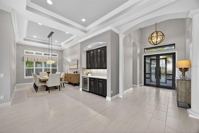 Discover unparalleled luxury in this exquisite Lakewood Ranch on Esplanade Golf and Country at Lakewood Ranch in Florida - for sale on GolfHomes.com, golf home, golf lot