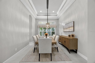 Discover unparalleled luxury in this exquisite Lakewood Ranch on Esplanade Golf and Country at Lakewood Ranch in Florida - for sale on GolfHomes.com, golf home, golf lot