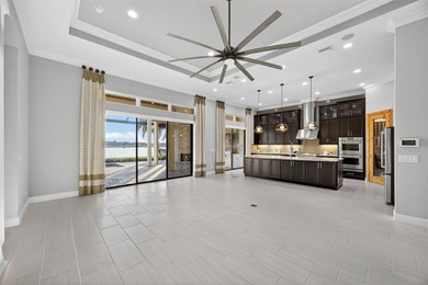 Discover unparalleled luxury in this exquisite Lakewood Ranch on Esplanade Golf and Country at Lakewood Ranch in Florida - for sale on GolfHomes.com, golf home, golf lot