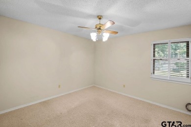 Nestled among mature trees, this charming 3-bedroom, 2-bath home on Hide-A-Way Lake Golf Course in Texas - for sale on GolfHomes.com, golf home, golf lot