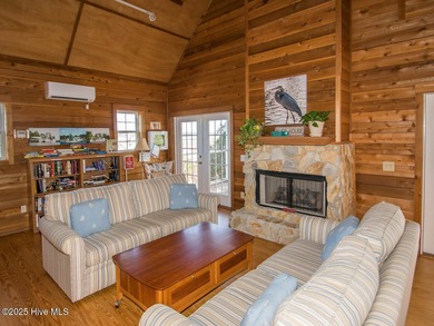 This lovely wooded, over a half acre, lot overlooks the 4th tee on Carolina National Golf Club in North Carolina - for sale on GolfHomes.com, golf home, golf lot