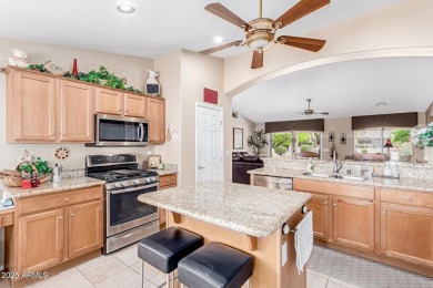 Beautiful landscaping greets you into this popular Palmera model on Oakwood Golf Club  in Arizona - for sale on GolfHomes.com, golf home, golf lot