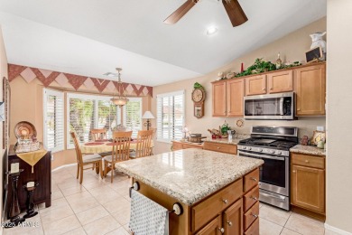 Beautiful landscaping greets you into this popular Palmera model on Oakwood Golf Club  in Arizona - for sale on GolfHomes.com, golf home, golf lot