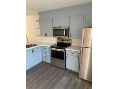 A must see recently renovated corner unit townhouse at Stamford on Bear Lakes Country Club in Florida - for sale on GolfHomes.com, golf home, golf lot