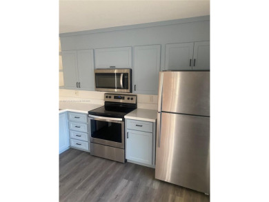 A must see recently renovated corner unit townhouse at Stamford on Bear Lakes Country Club in Florida - for sale on GolfHomes.com, golf home, golf lot