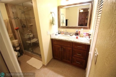 2-BEDROOM, 2-BATHROOM CONDOMINIUM IN SUNRISE LAKES OFFERS AN on Sunrise Lakes Phase III in Florida - for sale on GolfHomes.com, golf home, golf lot