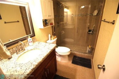 2-BEDROOM, 2-BATHROOM CONDOMINIUM IN SUNRISE LAKES OFFERS AN on Sunrise Lakes Phase III in Florida - for sale on GolfHomes.com, golf home, golf lot