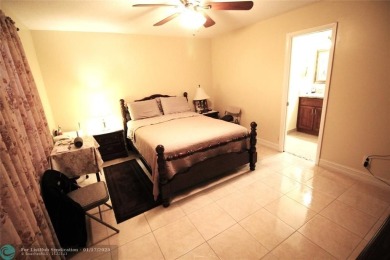 2-BEDROOM, 2-BATHROOM CONDOMINIUM IN SUNRISE LAKES OFFERS AN on Sunrise Lakes Phase III in Florida - for sale on GolfHomes.com, golf home, golf lot