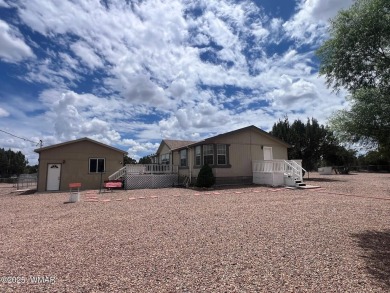 Fully furnished home in White Mountain Lakes on a spacious 0 on Silver Creek Golf Club in Arizona - for sale on GolfHomes.com, golf home, golf lot
