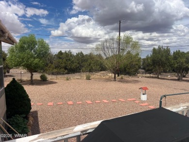 Fully furnished home in White Mountain Lakes on a spacious 0 on Silver Creek Golf Club in Arizona - for sale on GolfHomes.com, golf home, golf lot