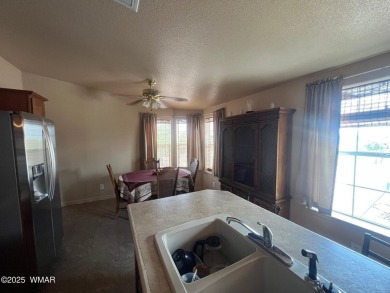 Fully furnished home in White Mountain Lakes on a spacious 0 on Silver Creek Golf Club in Arizona - for sale on GolfHomes.com, golf home, golf lot