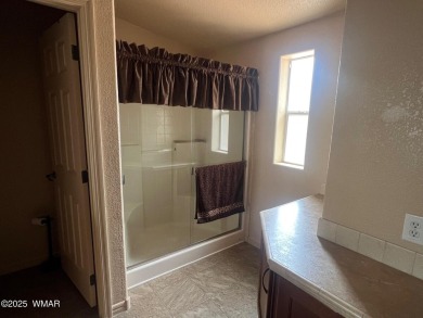 Fully furnished home in White Mountain Lakes on a spacious 0 on Silver Creek Golf Club in Arizona - for sale on GolfHomes.com, golf home, golf lot
