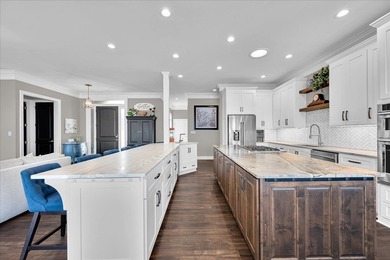 Experience elevated lake living at 244 Compass Point where on The Patriot Golf Club At Grand Harbor in South Carolina - for sale on GolfHomes.com, golf home, golf lot