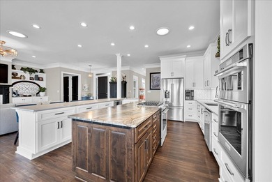 Experience elevated lake living at 244 Compass Point where on The Patriot Golf Club At Grand Harbor in South Carolina - for sale on GolfHomes.com, golf home, golf lot