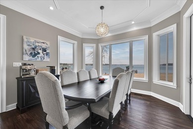 Experience elevated lake living at 244 Compass Point where on The Patriot Golf Club At Grand Harbor in South Carolina - for sale on GolfHomes.com, golf home, golf lot