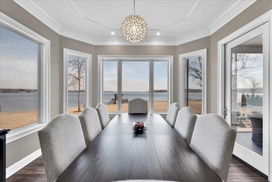 Experience elevated lake living at 244 Compass Point where on The Patriot Golf Club At Grand Harbor in South Carolina - for sale on GolfHomes.com, golf home, golf lot