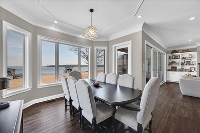 Experience elevated lake living at 244 Compass Point where on The Patriot Golf Club At Grand Harbor in South Carolina - for sale on GolfHomes.com, golf home, golf lot