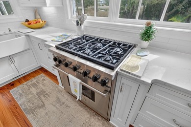 Beautiful brick custom home with FIRST FLOOR PRIMARY SUITE on Dunes West Golf Club in South Carolina - for sale on GolfHomes.com, golf home, golf lot