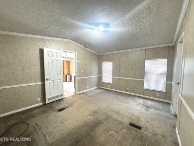 Welcome to your new home! This corner lot manufactured home in on Lake Tansi Village Country Club in Tennessee - for sale on GolfHomes.com, golf home, golf lot