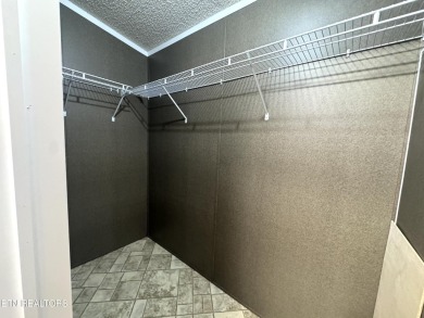 Welcome to your new home! This corner lot manufactured home in on Lake Tansi Village Country Club in Tennessee - for sale on GolfHomes.com, golf home, golf lot