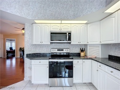 Spectacular north-facing views of a large LAKE and the GOLF on Herons Glen Golf and Country Club in Florida - for sale on GolfHomes.com, golf home, golf lot